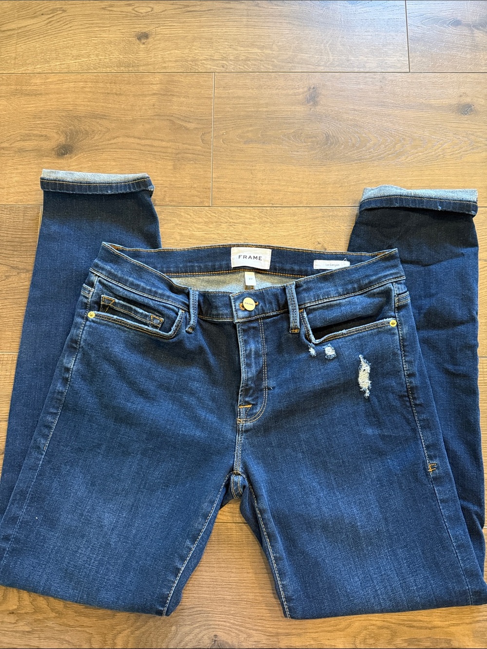 Frame Denim Deep Indigo Skinny Jeans with Subtle Distress